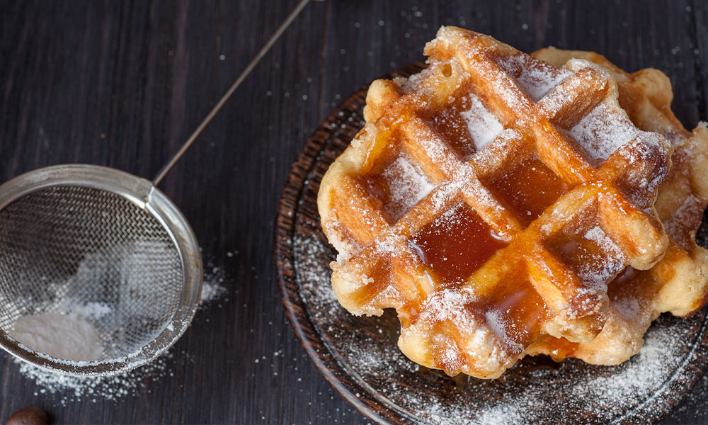 Liege waffle on a plate with syrup