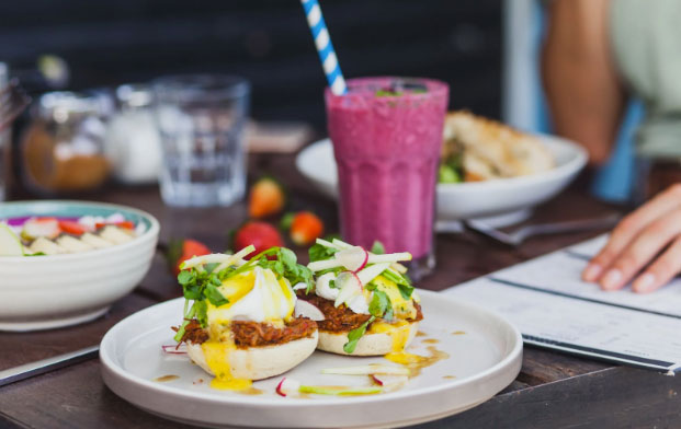 Food and smoothie on a table in a cafe